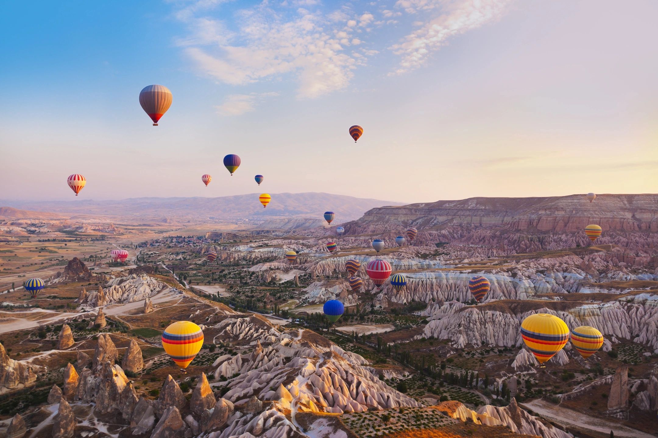 Hot air balloons over a landscape representing emotional regulation and wellbeing